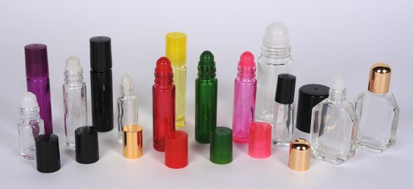 Wholesale Bottles Glass Roll-ons in flint, red, blue, green, yellow, and black. Additional Personal Care Containers with a variety of sprayers and applicator caps.